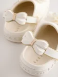 Baker by Ted Baker Ivory Bow Charm Clog Sandals